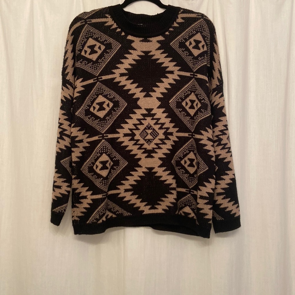 Lumière sweater, worn but in good condition.